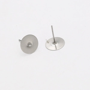 Macro detail of silver stainless steel flat pad earring posts for DIY jewelry making