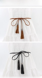 Close-up of woven PU leather waist belts with tassels in black and brown finishes
