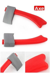 Detail view of a toy firefighter axe made of red and grey plastic with wood grain texture