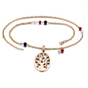 Golden Tree of Life necklace with rhinestones and colored beads on a white background