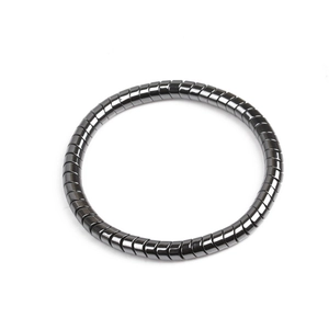 Detailed view of gunmetal segmented magnetic bracelet with polished metallic finish