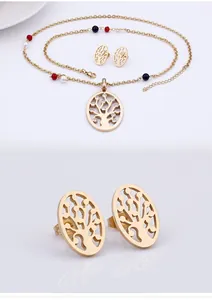 Macro detail of gold tree of life earrings and necklace with colorful bead accents