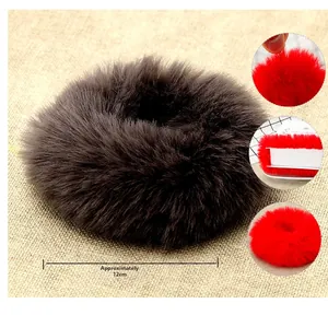 Detail showing plush faux fur texture and 12cm diameter scale of the winter scrunchie