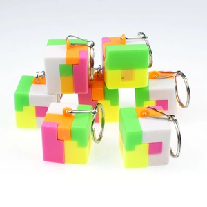 Close-up of colorful cube puzzle keychains with plastic blocks and metal rings