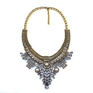Detailed close-up of multi-layer pearl and crystal teardrop statement necklace with gold alloy
