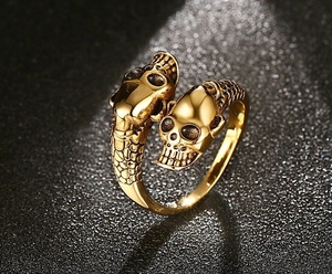 Detailed view of vintage gold skull open ring with intricate scale texture and punk design
