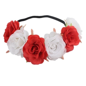 Red and white artificial rose floral headband with black elastic band on white background