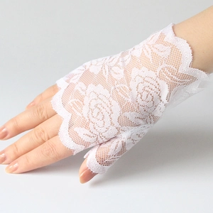 Detailed view of white floral lace fingerless sun protection gloves for summer driving