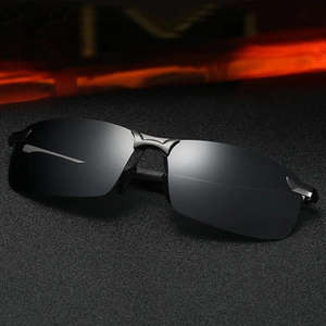 Detailed 45-degree close-up of premium black oversized polarized sunglasses with metal frame