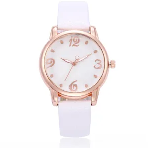 Detail of floral dial quartz watch with white honeycomb strap and rose gold case