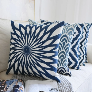 Blue and white porcelain style embroidered cushion covers with geometric floral patterns