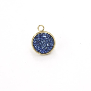 Macro shot of 12mm round blue druzy resin pendant with gold stainless steel frame