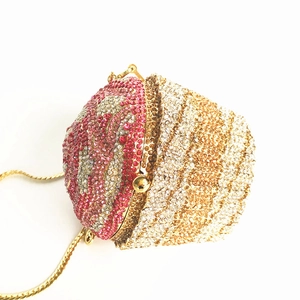Macro shot of cupcake-shaped evening clutch bag featuring pink and silver rhinestones