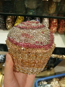 Macro shot of a luxury cupcake clutch bag with sparkling crystals for evening parties