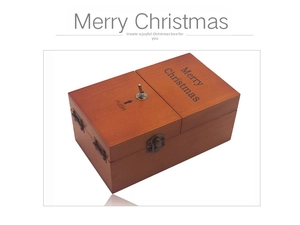 Macro detail of wooden Useless Box with Merry Christmas engraving and metal clasp
