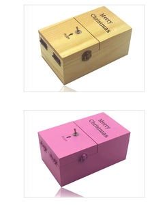 Detail of wooden useless box in natural and pink finishes with Merry Christmas engraving
