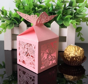 Pink laser-cut butterfly favor box with pearl paper texture for wedding candy storage