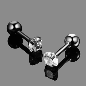 Macro view of black stainless steel ear studs with four-prong set round cubic zirconia