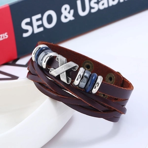 Men's multilayer brown leather bracelet with vintage metal charms and bead details