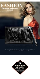 Detail of black crocodile texture clutch bag with wrist strap and metal zipper