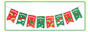Detail of Christmas paper bunting featuring Santa, reindeer, and festive motifs