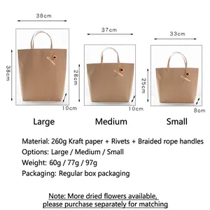 Three sizes of vintage brown kraft paper gift bags with rope handles and metal rivets