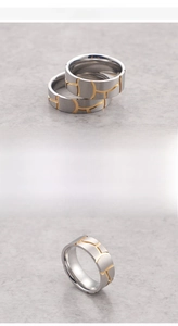 Detail view of matte steel ring with 18K gold plated geometric patterns and fine texture