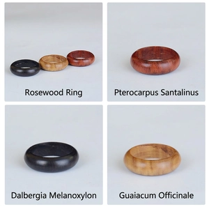 Handcrafted sandalwood rings set in bloodwood, ebony, and green sandalwood finish