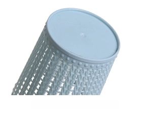 Macro detail of a blue plastic desk bin featuring hollow-out mesh and a reinforced base