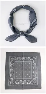 Detail of dark grey paisley 100% cotton bandana showing knotted and flat layout