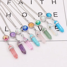 Detailed view of multiple colorful crystal hexagonal cone pendants with silver chains