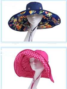 Detail view of foldable beach sun hats with floral lining and adjustable windproof strap