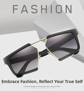 Detail of oversized geometric sunglasses MD5709 with black and gold frame and gradient lenses