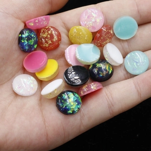 Handful of 12mm colorful oval synthetic opal resin stones with foil flakes for DIY jewelry