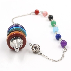 Detailed view of 7 chakra stones pendulum pendant with colorful beads on a silver chain
