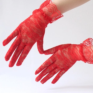 Detailed close-up of red floral lace gloves with ruffled elastic wrists for elegant events
