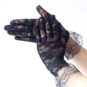 Close-up of black lace gloves with floral patterns and ruffled edges for sun protection