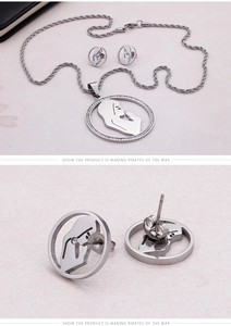 Detailed macro view of rhinestone jewelry set with cutout silhouette pendants
