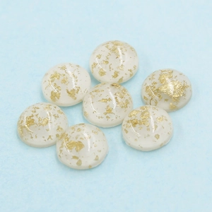 Top view of 12mm white translucent oval resin gems with gold foil flakes for DIY jewelry