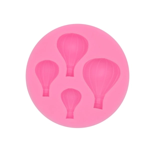 Pink silicone mold with four hot air balloon shapes for DIY baking and cake decoration