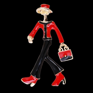 Modern enamel brooch featuring a woman in a red and black suit with a stylish handbag
