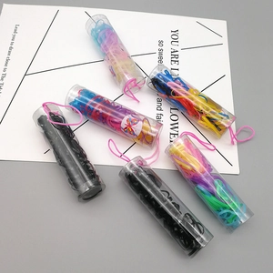 Black and multi-color hair elastics set in a portable plastic jar with a pink strap