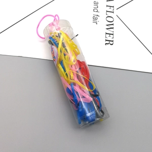 Colorful kids hair elastics in a transparent cylinder container with a pink lanyard