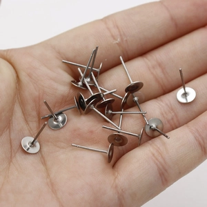 Flat head stainless steel ear studs for DIY jewelry making displayed in a hand palm
