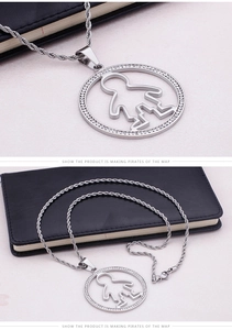 Detailed macro view of a silver titanium steel rope chain with a round rhinestone pendant
