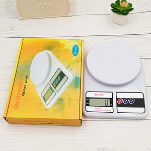 White SF-400 digital kitchen scale 10kg capacity with retail box on wood background