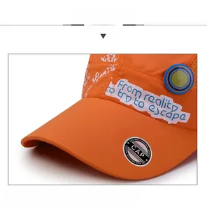 Close-up of bright orange quick-dry baseball cap with stylish side print and black brim sticker