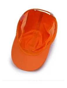 Detail view of the breathable mesh lining and size label on the orange kids sun hat