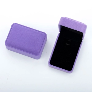 Detailed view of luxury purple velvet jewelry boxes for necklaces and bracelets