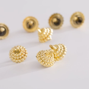 Golden Christmas ornament caps with textured bead pattern and metal shank back design